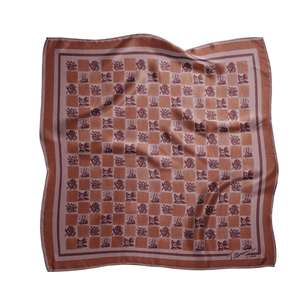 Silk foulard in warm terracotta tones with a checkered floral pattern, designed and printed in Lisbon by Tillerman, curated by Névoa Zurich.