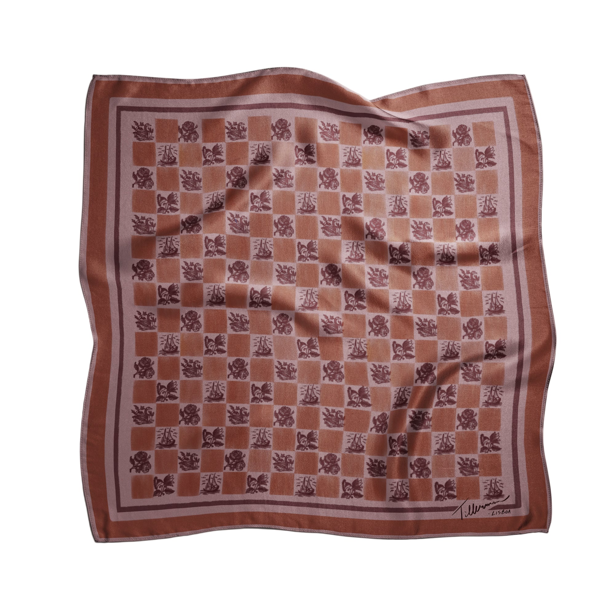 Silk foulard in warm terracotta tones with a checkered floral pattern, designed and printed in Lisbon by Tillerman, curated by Névoa Zurich.