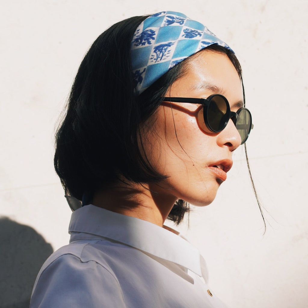 Silk foulard Santa Luzia blue by Tillerman worn as a headband - curated and sold by Névoa Zurich