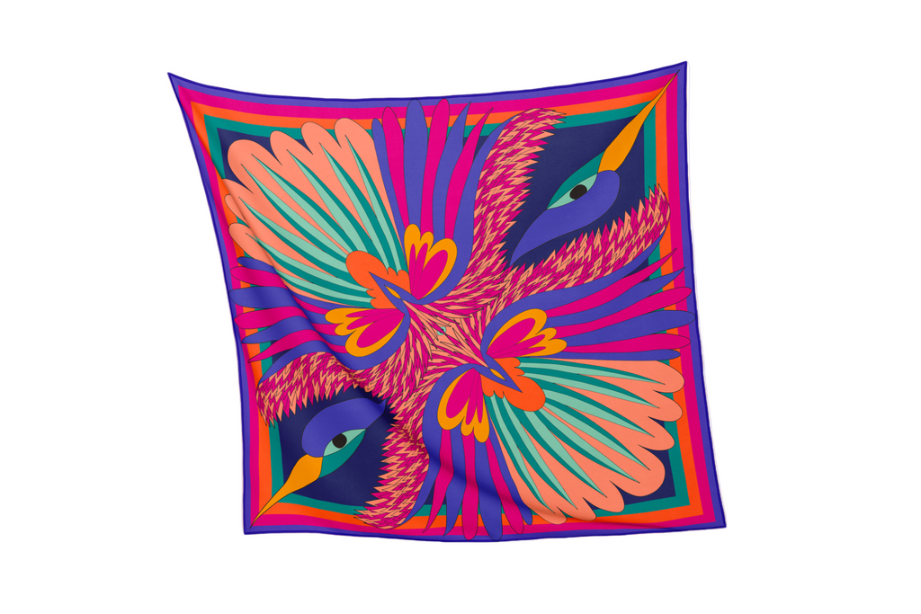 full view of purple orange pink silk cotton foulard named carnaval nuit with decorative birds and bold colorful patterns